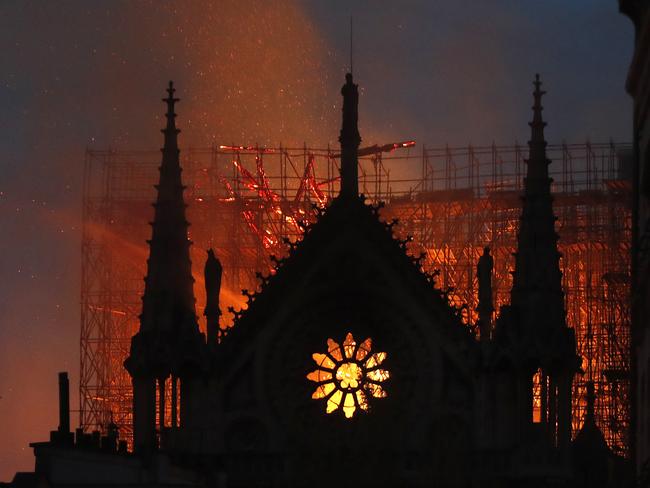 Flames and smoke rise from Notre Dame cathedral as it burns in Paris, Monday, April 15, 2019. (AP Photo/Thibault Camus)