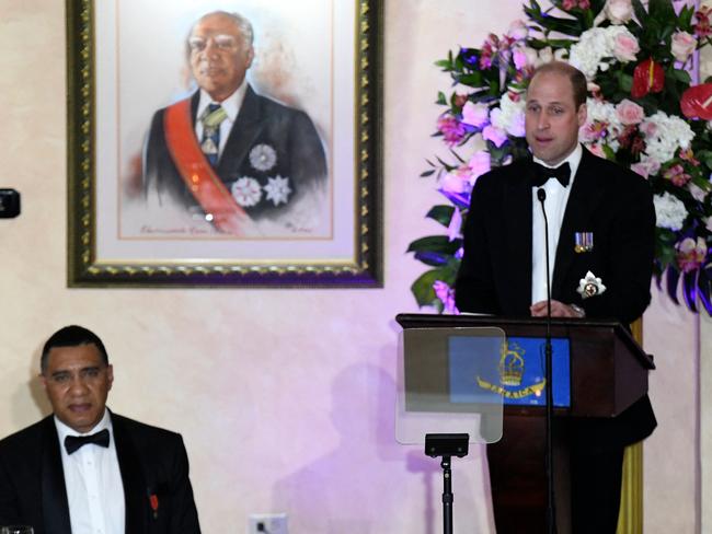 Prince William delivers a speech flanked by Jamaican Prime Minister Andrew Holness during a state dinner at Kings House. Picture: AFP