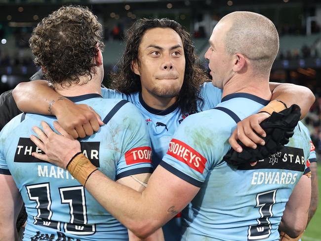 MELBOURNE, AUSTRALIA - JUNE 26:  Jarome Luai of the Blues celebrates with Liam Martin of the Blues and Dylan Edwards of the Blues after winning game two of the men's State of Origin series between New South Wales Blues and Queensland Maroons at the Melbourne Cricket Ground on June 26, 2024 in Melbourne, Australia. (Photo by Cameron Spencer/Getty Images)