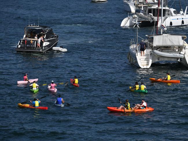 People on Canoes and Yachts gather at Farm Cove in preparation for New Years Eve Fireworks in Sydney, Monday, December 31, 2018. Picture: AAP / Brendan Esposito