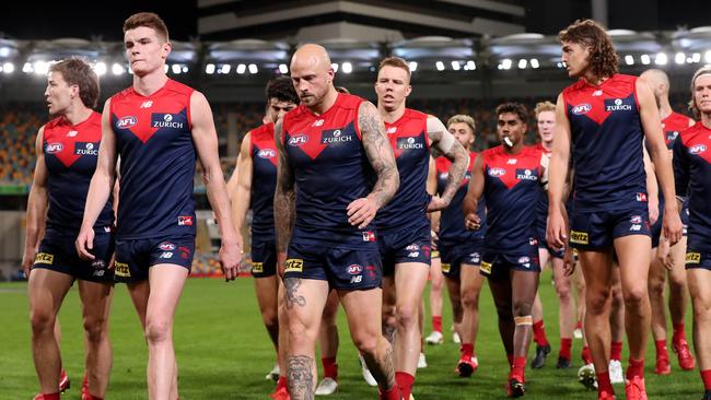 Melbourne players leave the field after their lacklustre performance against Port Adelaide. Picture: Michael Klein