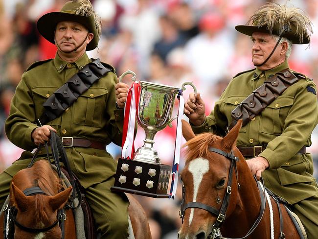 Light Horse Brigade reenactors enter the stadium to deliver the Anzac Day trophy ahead of the Round 8 NRL match between the St George Illawarra Dragons and the Sydney Rooster at Allianz Stadium in Sydney, Wednesday, April 25, 2018. (AAP Image/Dan Himbrechts) NO ARCHIVING, EDITORIAL USE ONLY