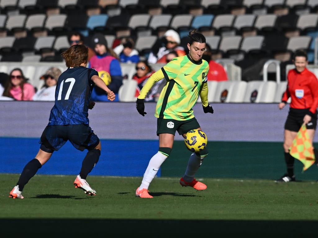 Matildas captain Steph Catley (right) controls the ball under pressure from Japan’s Maika Hamano during Australia’s 4-0 loss. Picture: Maria Lysaker/Getty Images