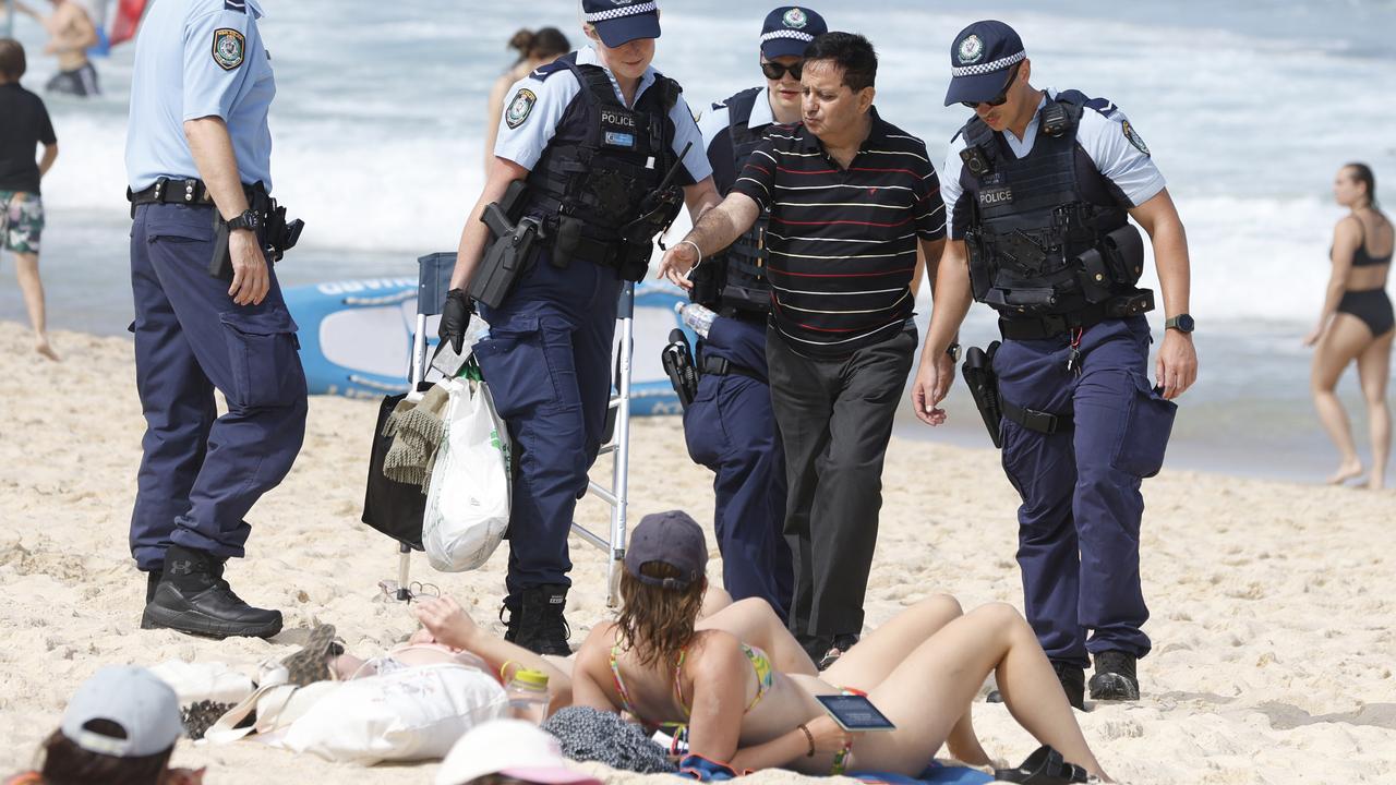 Sunbakers shocked after beach arrest