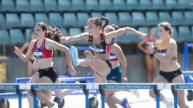 Tammin Lampret from Endeavour HS winning the Girls 90m hurdles