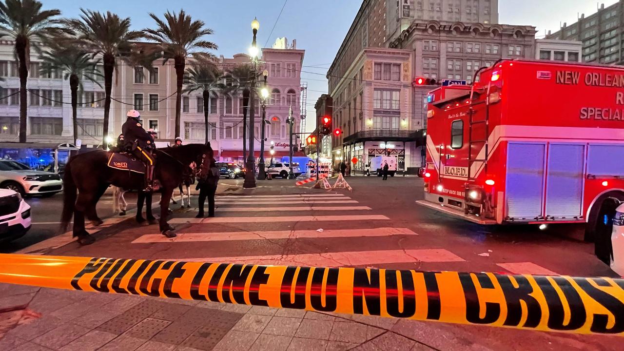 Police cordon off the intersection of Canal Street and Bourbon Street in the French Quarter of New Orleans, Louisiana, on January 1, 2025. (Photo by Matthew HINTON / AFP)