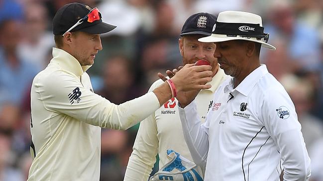 England captain Joe Root holds up the ball for umpire Joel Wilson to smell during the first Ashes Test at Edgbaston. Picture: Getty Images