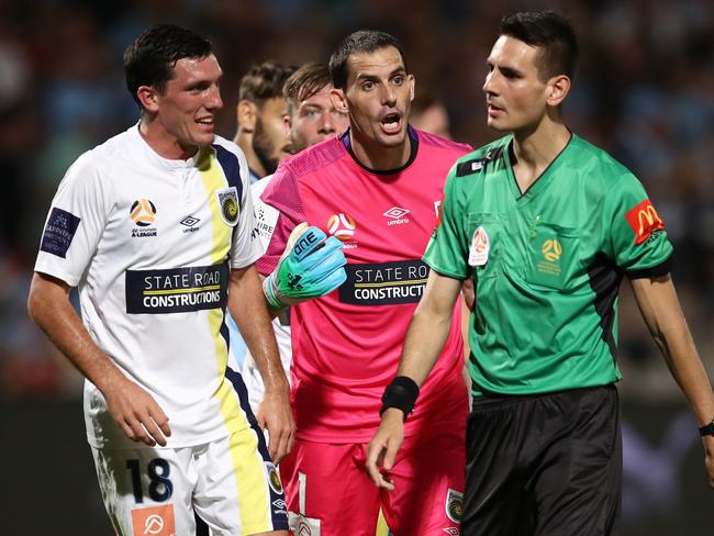 Goalkeeper Ben Kennedy protests with referee Jonathan Barreiro during the match against Sydney FC. Picture: Brendon Thorne