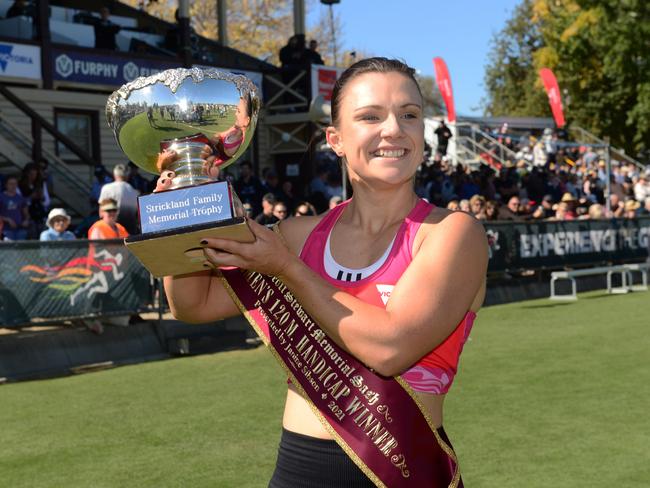 South Australian Hayley Orman lifts the women’s trophy. Picture: Michael Marschall