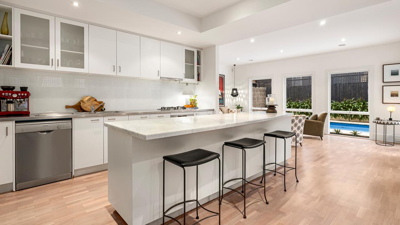 The kitchen fitted out with Bosch appliances as well as marble and stainless-steel surfaces.