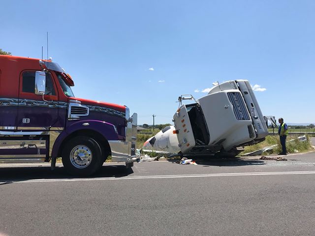 Two trucks have closed the Pacific Highway for two different reasons. Picture: Jarrard Potter