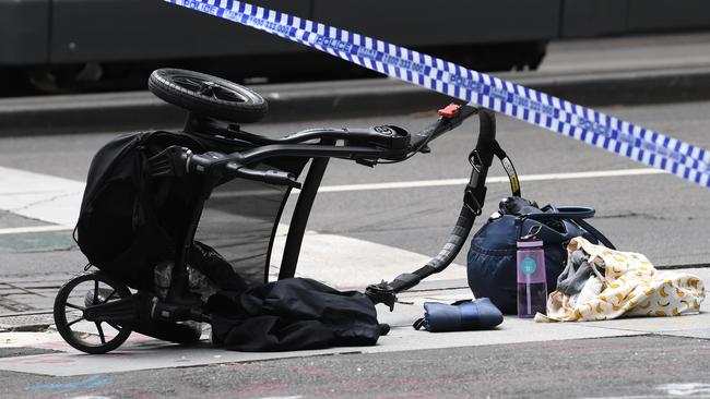 A pram lies on Bourke St after the rampage.