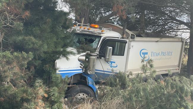 A truck driver was killed in Moriac, near Geelong, on Saturday after he hit a truck and then veered into a tree. Photo: Alan Barber.