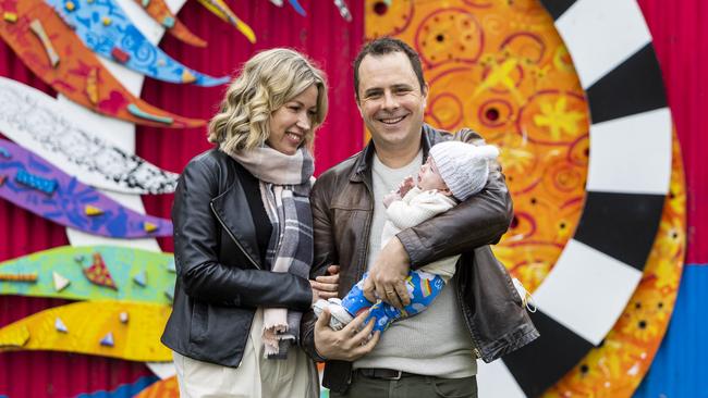 Chloe Elliott with her husband Stuart Speirs and their 10-week-old daughter Ellie, near their home in Footscray. Picture: Aaron Francis/The Australian