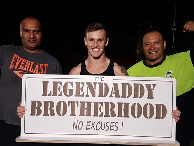 Mitchell Lowe with two members of the Legendaddy fitness program, a group that helps fathers transform their bodies and attitudes.