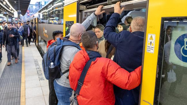 People crowding onto a train preparing to leave from Central Station. Picture: Thomas Lisson