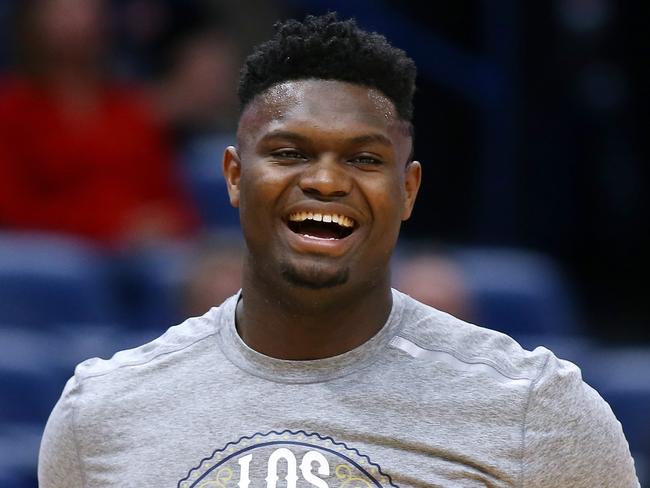 (FILES) In this file photo taken on March 6, 2020 Zion Williamson #1 of the New Orleans Pelicans warms up before a game against the Miami Heat at the Smoothie King Center on March 06, 2020 in New Orleans, Louisiana. - NBA players Giannis Antetokounmpo and Zion Williamson are among a growing list of athletes and teams pledging to provide financial assistance to stadium workers who will suffer wage losses due to the coronavirus pandemic. (Photo by Jonathan Bachman / GETTY IMAGES NORTH AMERICA / AFP) / TO GO WITH AFP STORY "NBA, NHL athletes step up to pledge assistance for idled arena workers"  NOTE TO USER: User expressly acknowledges and agrees that, by downloading and or using this Photograph, user is consenting to the terms and conditions of the Getty Images License Agreement.