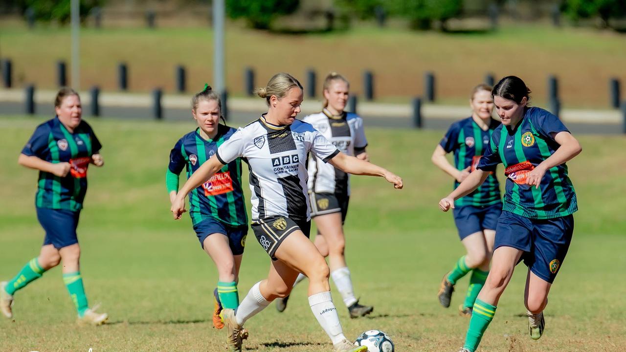 Shadell Doro (left) takes on the Highfields defence.