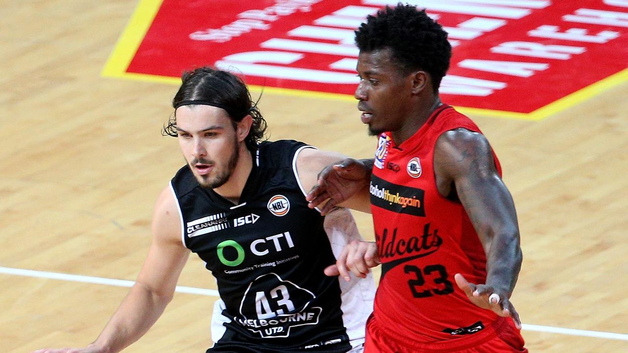 Chris Goulding of United runs the ball up the court under pressure from Casey Prather of the Wildcats during the NBL Match Melbourne United versus the Perth Wildcats at Hisense arena in Melbourne on Sunday 27th December, 2015. Picture: Mark Dadswell