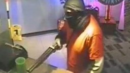 A man armed with a shotgun during a robbery of the Cove Tavern in August 2014. Picture: SA Police