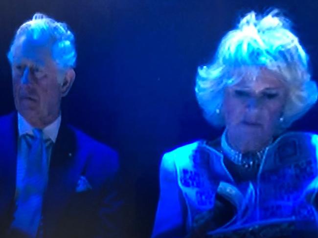 A still from footage showing the Duchess of Cornwall flipping through a program during the opening ceremony on the Gold Coast.