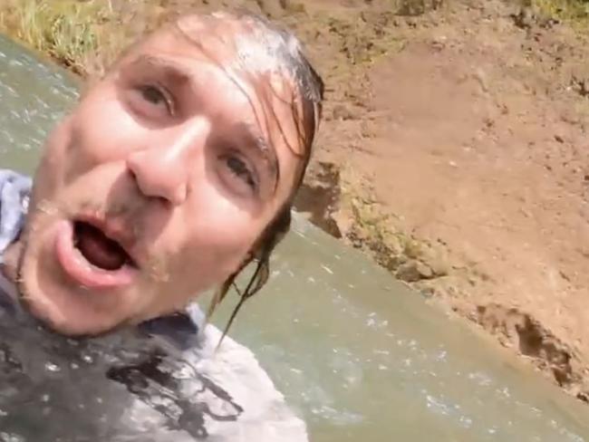 The man was filmed jumping into the Tully River in far north Queensland.