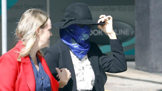 The court was told Heath (right, face covered) procured the man, who was just a teenager at the time, into prostitution between 2000 and 2001, including an occasion where he ended up performing oral sex on an unknown man. Picture: NCA NewsWire/Tertius Pickard