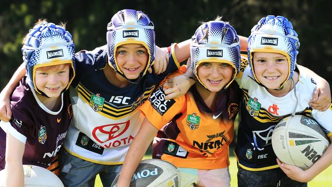 Little league players L-R Austin Pyne, Jake Moffat, Noah Moffat and Archie Riccio wear Johnathan Thurston head gear at Captain Cook playing fields in Cronulla. Picture: Toby Zerna