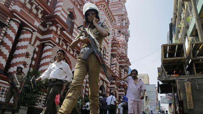 A Sri Lankan police officer patrols out side a mosque in Colombo on Wednesday. Picture: Eranga Jayawardena/AP