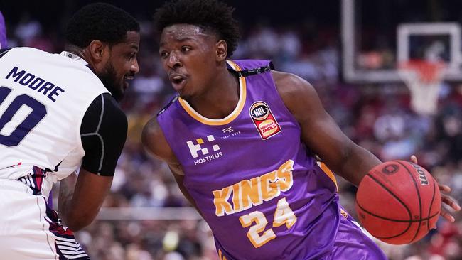 The Kings’ Jae'Sean Tate takes on the 36ers Ramone Moore on Saturday night. Picture: Getty Images