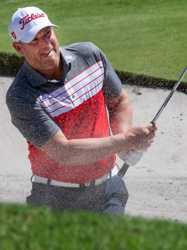 Shane Warne finds himself in a bunker at the Metropolitan Gold Club on Monday. Picture: Jay Town