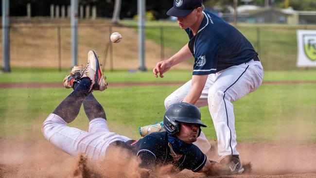 A Malvern player slides into home plate. Picture: Jackson Geall.