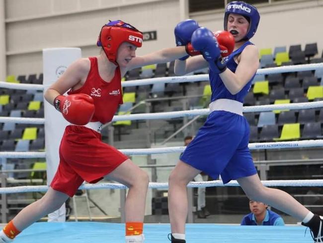 Ciara Storch (red) in the ring in her youth.