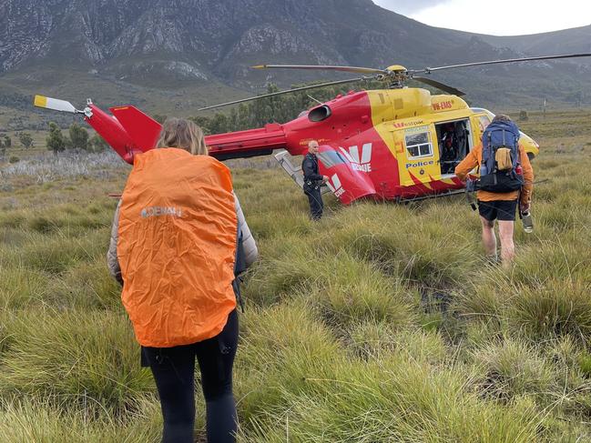 Two of the bushwalkers make their way to the Westpac chopper