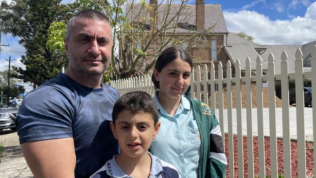 Matt Tabarni with his son Lucas and daughter Mia outside Westmead Christian Grammar.