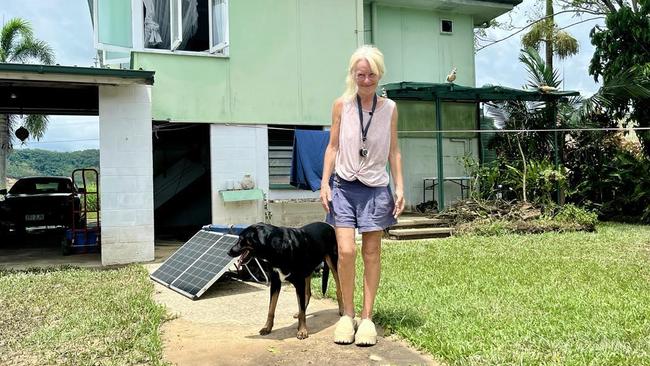 Camille O'Sullivan, a Catholic Education teacher, outside her flood-ravaged home in Cordelia on the banks on the Herbert River. Picture: Cameron Bates