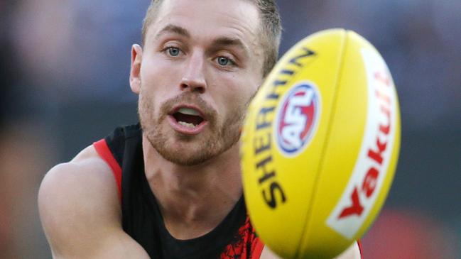 AFL Round 6. 24/04/2019. Richmond v Melbourne at the MCG.   Essendon's Devon Smith  clears b y hand 2nd quarter    . Pic: Michael Klein.