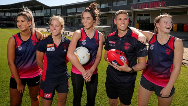 Casey netball and VFLW players with VFL player Mitch Lewis. Picture: Stuart McEvoy