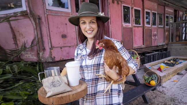 The Mornington Peninsula’s Benton Rise Farm, a commercial farmgate and cafe, is for sale. Owner Isabel Carter stands outside a converted Red Rattler train carriage used as the farmgate’s shop. Picture: Wayne Taylor.