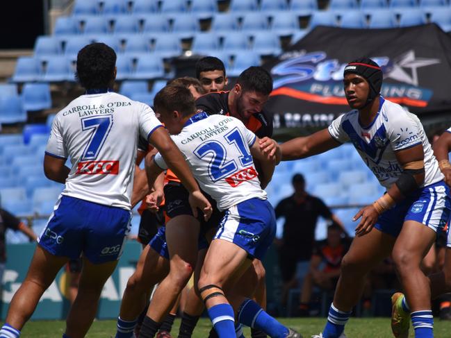 Tony (Tanous) Sukkar is tackled by Jed Reardon. Picture: Sean Teuma/NewsLocal