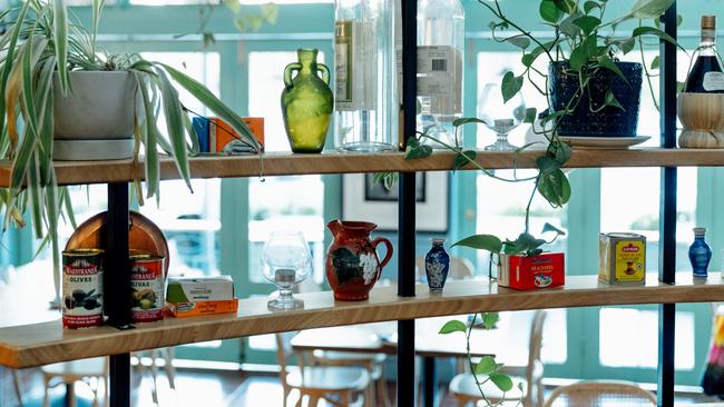 Odds and ends and artefacts line the shelves inside House of George in the East End of Adelaide