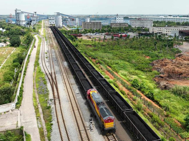 Train cars filled with coal sit at a storage centre in Jiujiang, in China's central Jiangxi province, last month. Picture: AFP