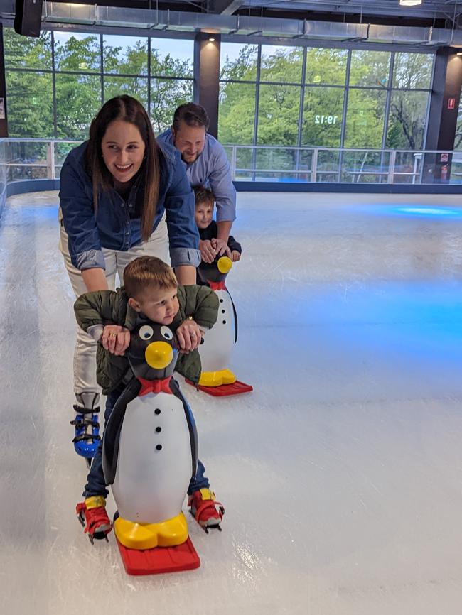 Skaters pictured with the penguins