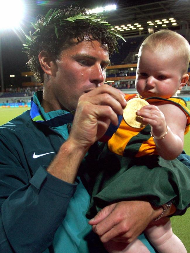 Could this be the start of a hockey dynasty as Brent Livermore is with then baby Kyra after a gold medal at the Athens Olympics in 2004.