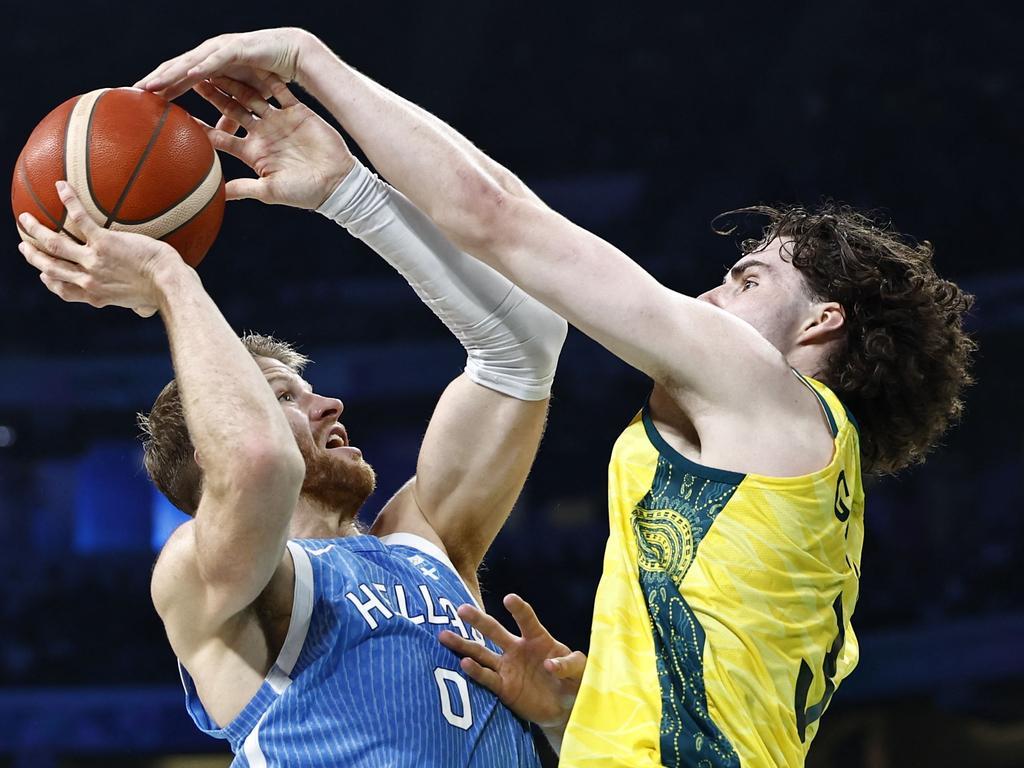 Thomas Walkup attempts to go to the basket past Australia's Josh Giddey. Picture: AFP