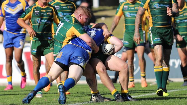 Strong Wolves defence stops St Patricks player Corey Nicholson. Picture: Steve Montgomery