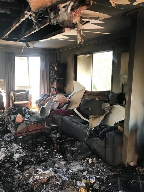 The lounge and the room in a Loganholme house where Henrietta, affectionately dubbed Henry, was found following a house fire.