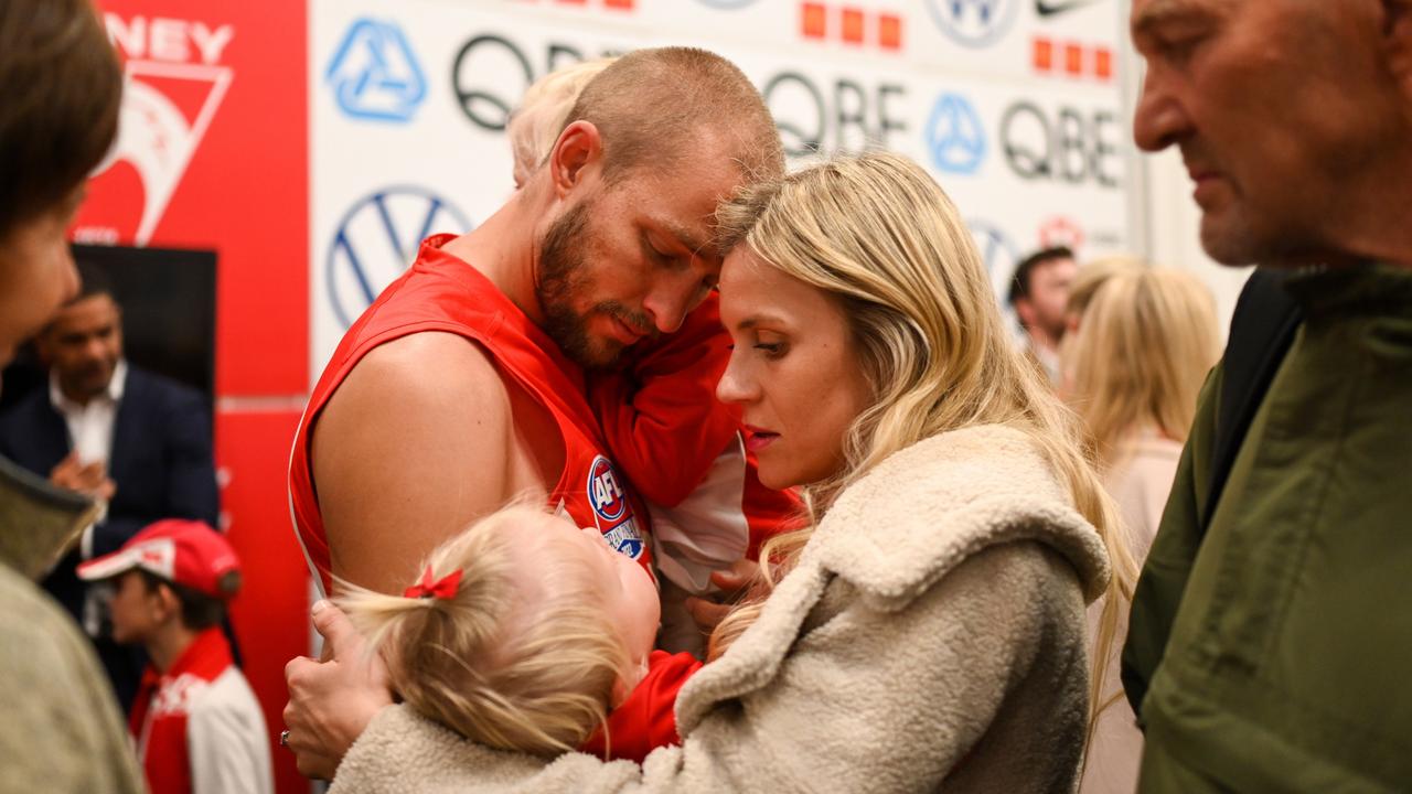 Sam Reid embraces his family after Sydney’s Grand Final loss.