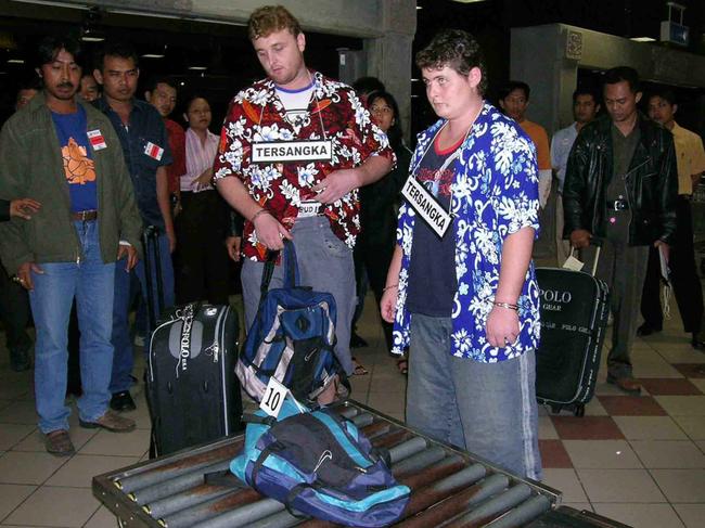 Martin Stephens and Renae Lawrence wore signs marked suspect at a 2005 re-enactment of their attempted drug smuggling operation. Picture: Supplied