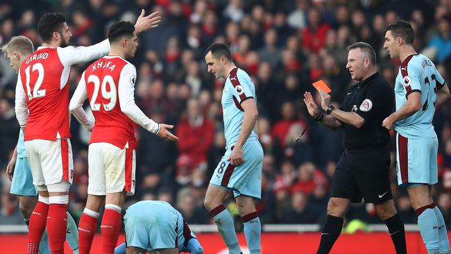 Granit Xhaka is shown a red card.